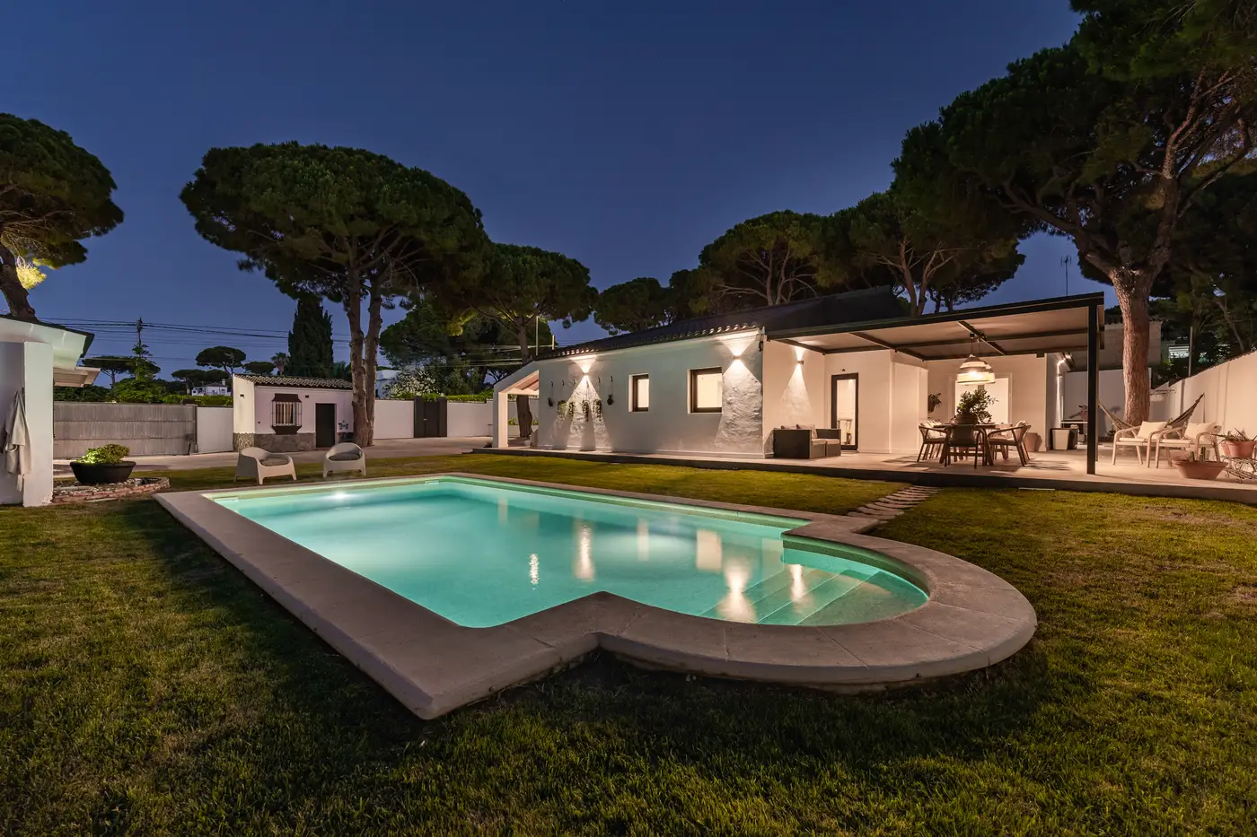 Illuminated pool at blue hour